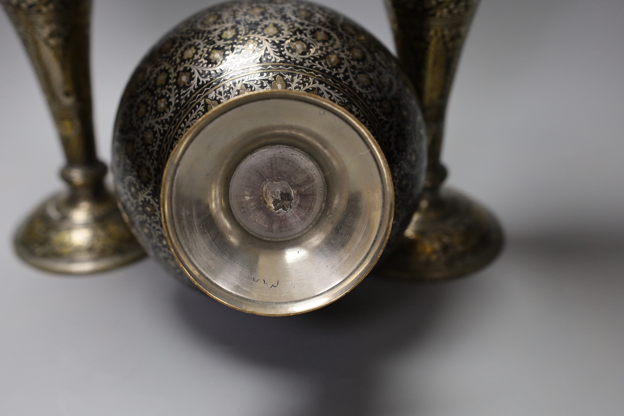 A pair of Indian damascened brass vases and a similar vase, pair of vases 33cms high